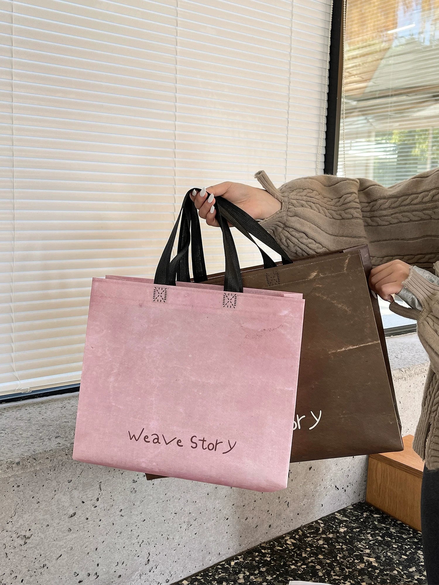 Pink and brown laminated non-woven tote bags shown in use