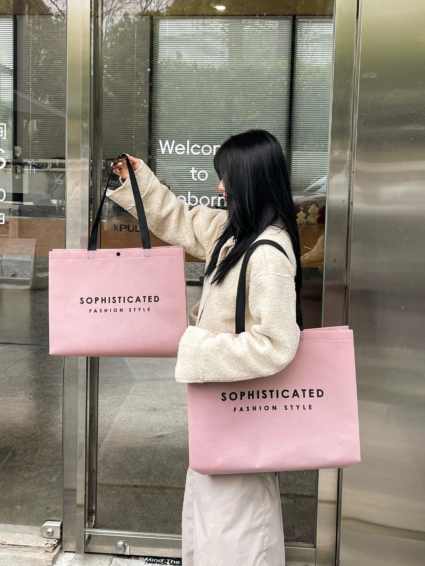Pink non-woven shopping tote shown in two sizes