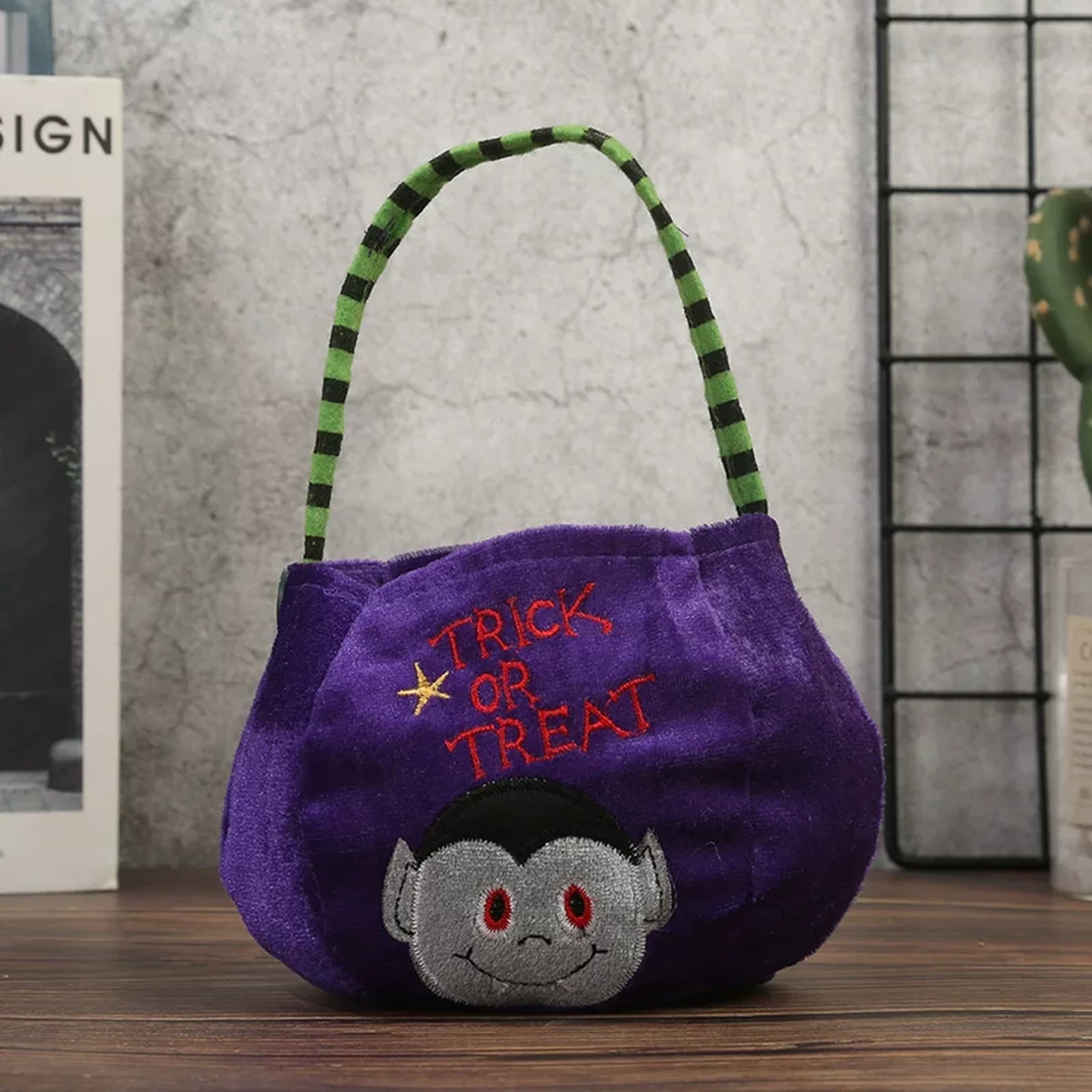 Purple plush Halloween bucket bag with vampire design