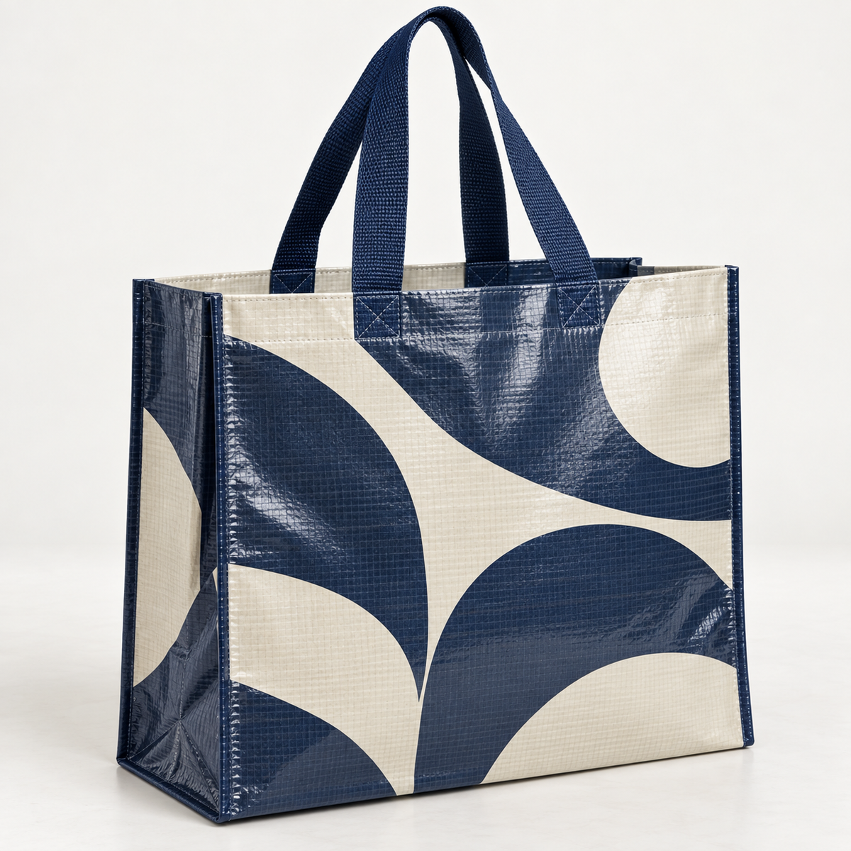 Laminated PP woven shopping tote bag with navy abstract print and side gusset