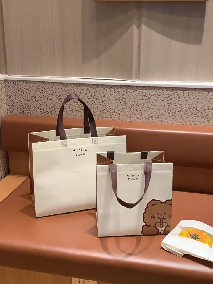 Video showing bear design laminated non-woven gift bags in use