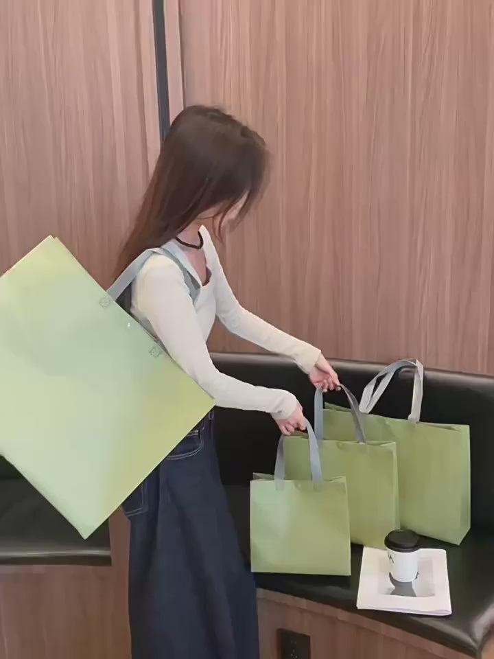 Reusable non-woven snap closure tote bags shown in multiple sizes