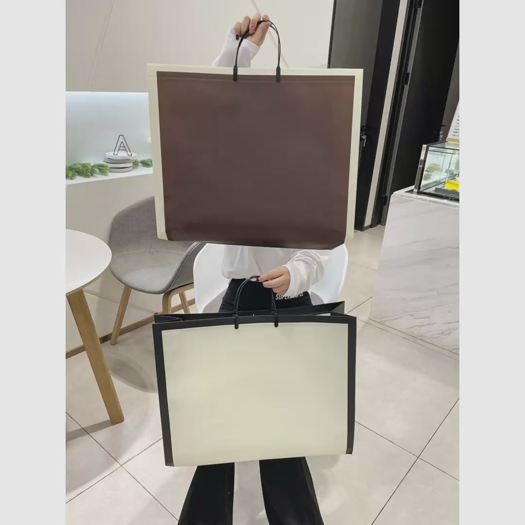 Laminated Large-Capacity Non-Woven Garment Packaging Bags — 2 Styles product video 1