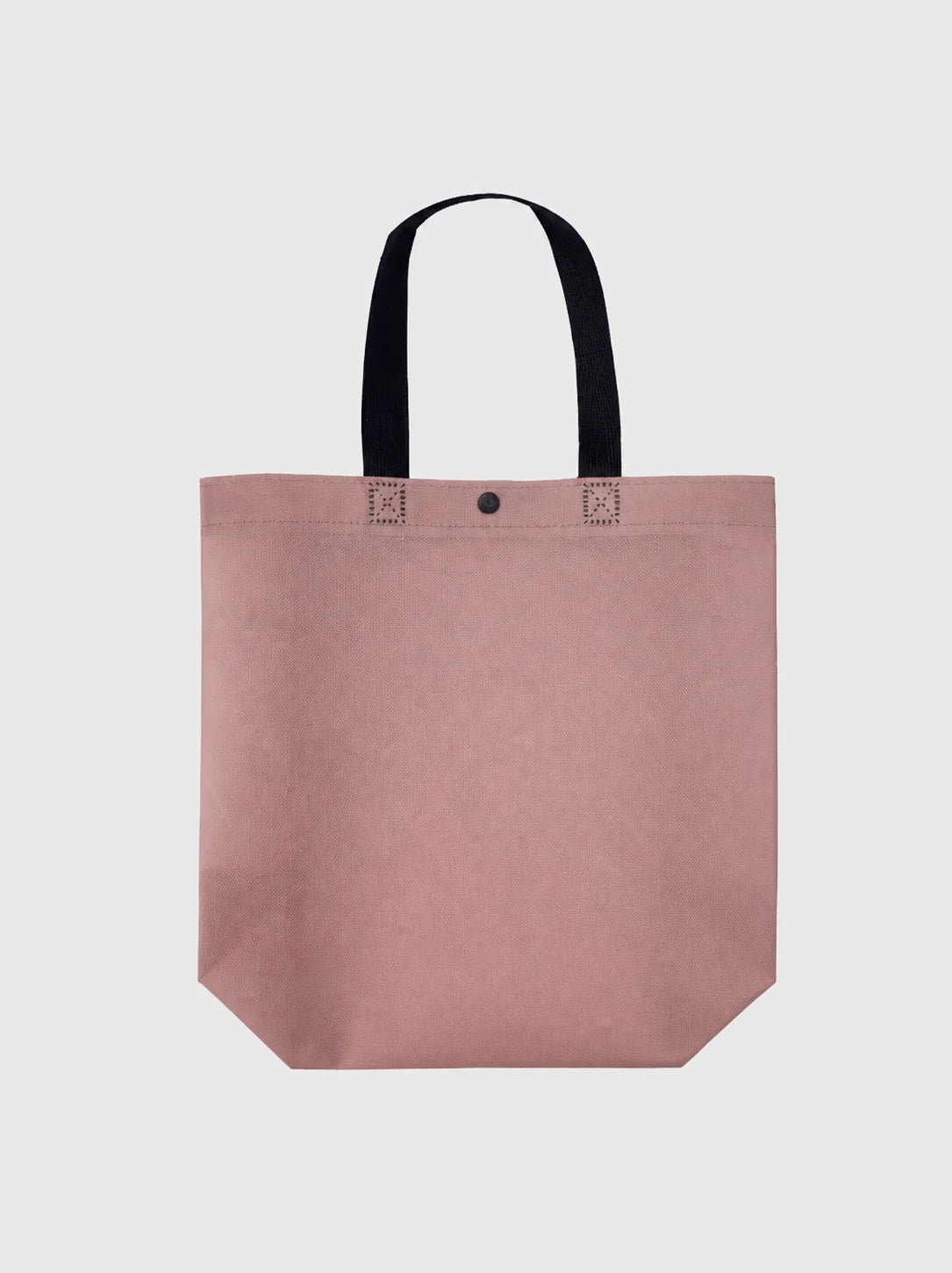 Front view of a purple non-woven tote bag with black handles and snap closure
