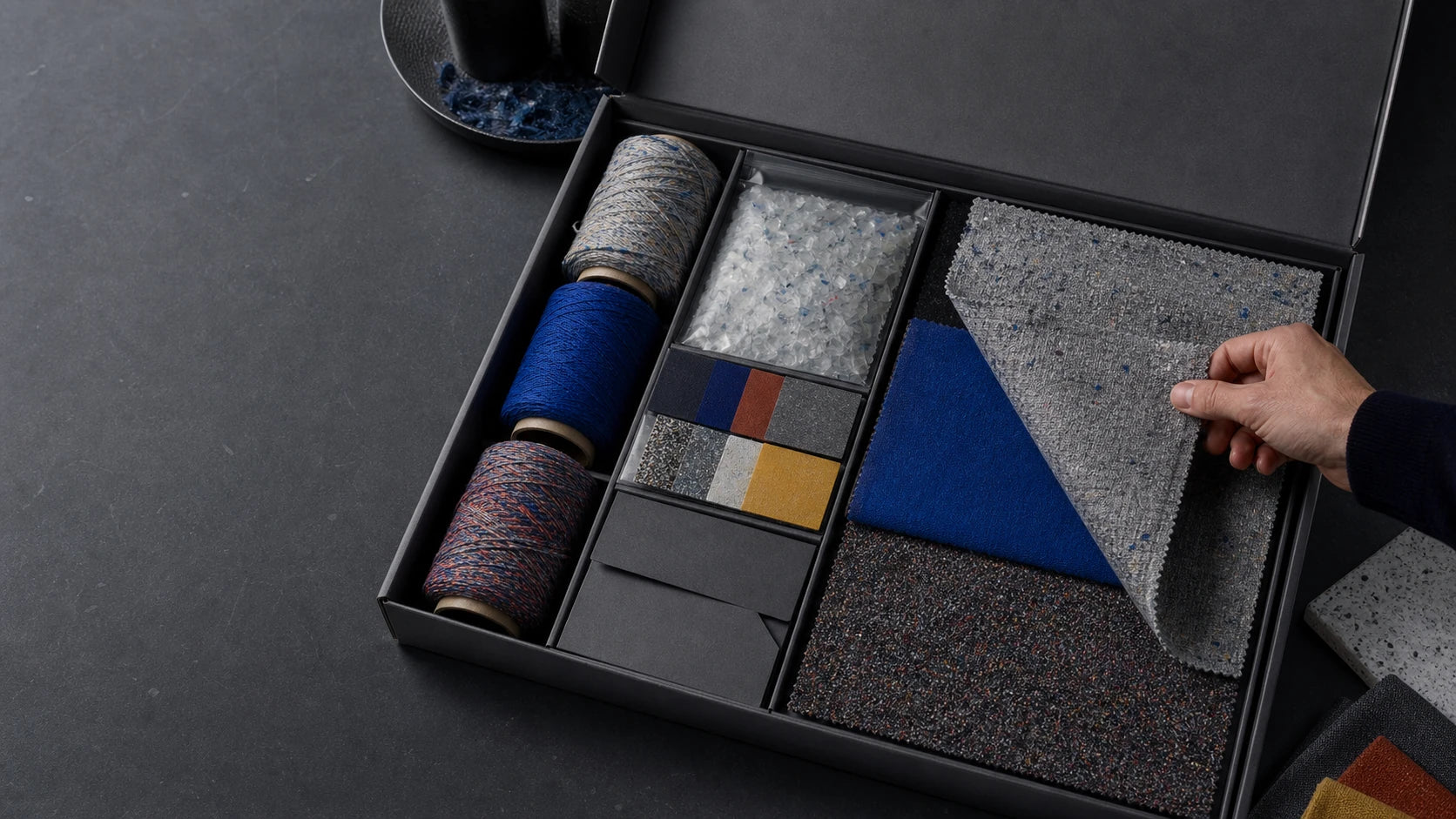 Open recycled textile traceability kit with swatches yarn PET flakes and color samples