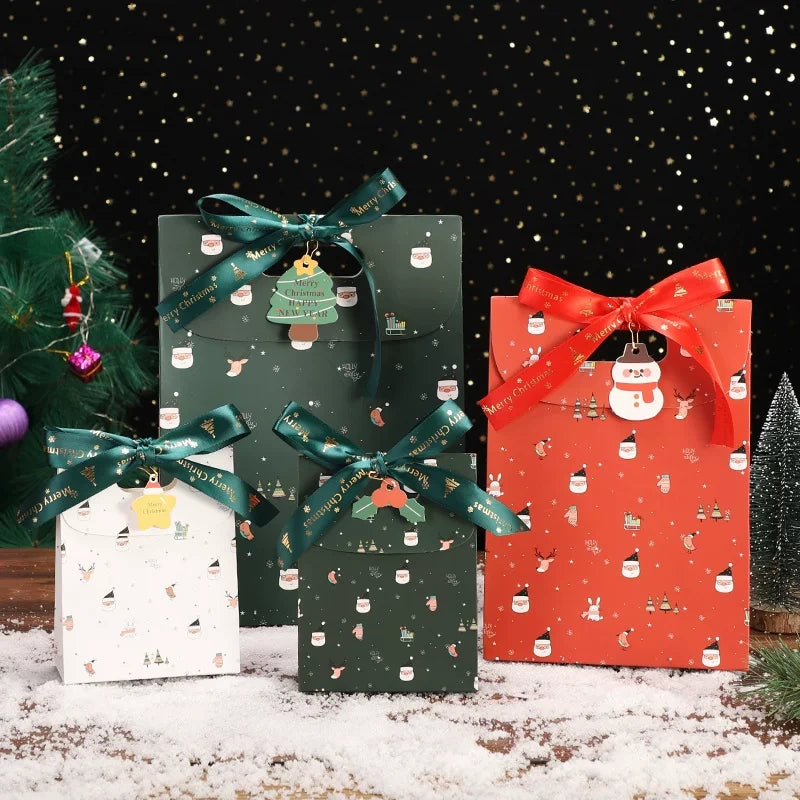 Christmas paper gift bags with ribbon handles in red, green and white