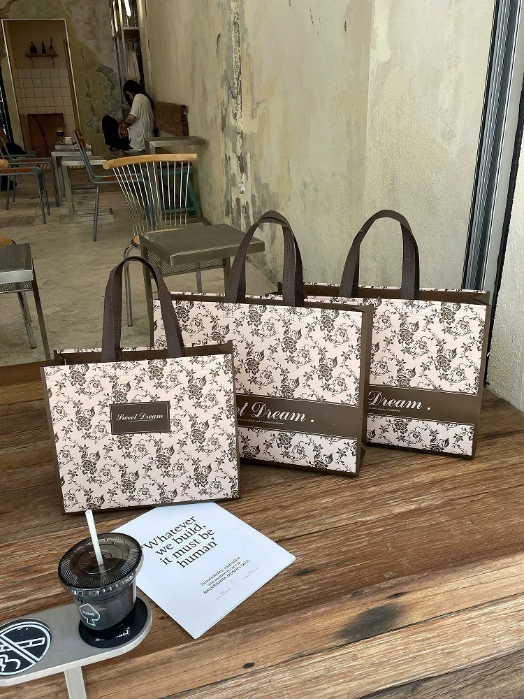 Rose floral non-woven tote bags in two sizes