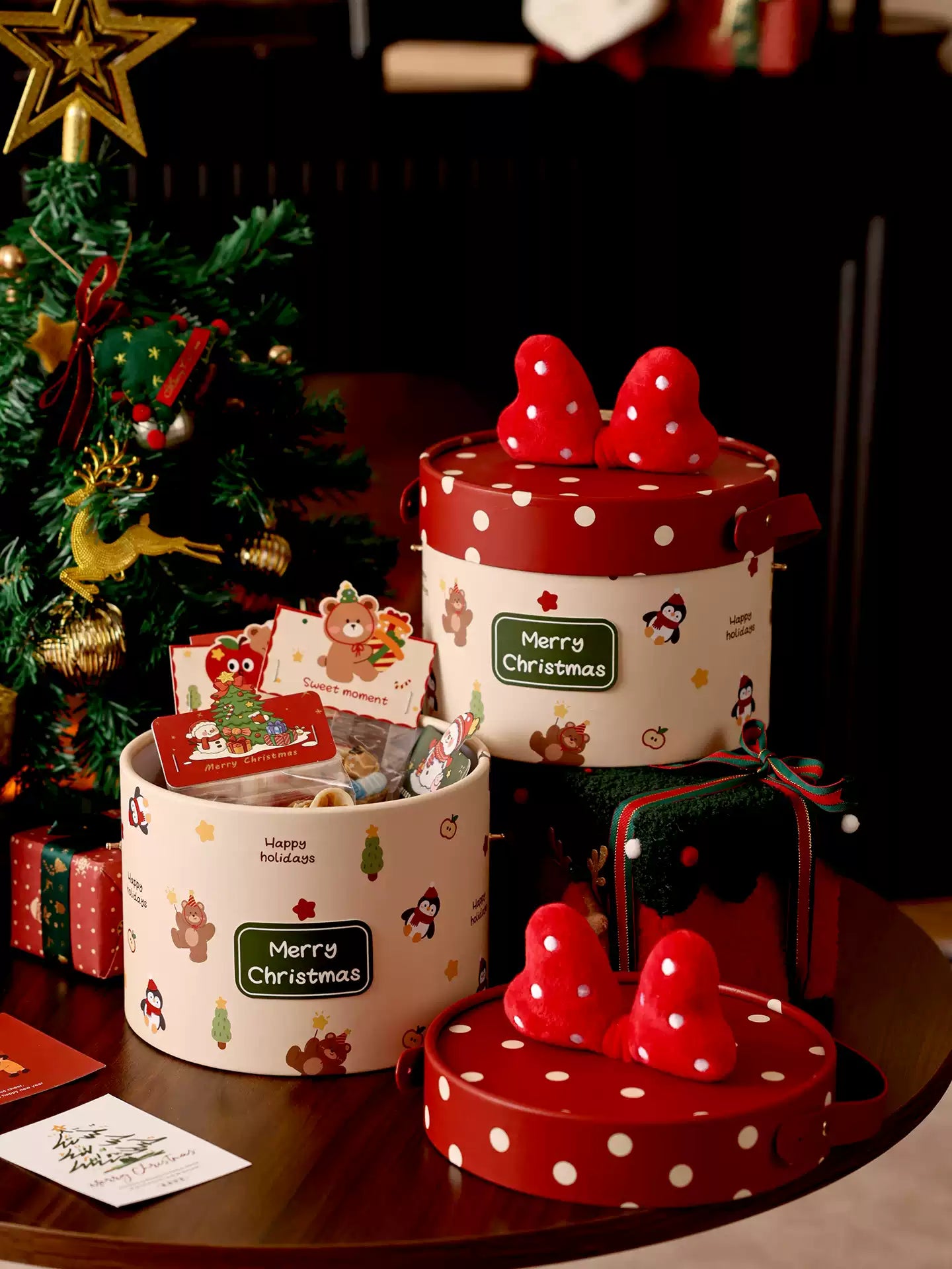 Round Christmas bow gift hatbox in a festive lifestyle setting