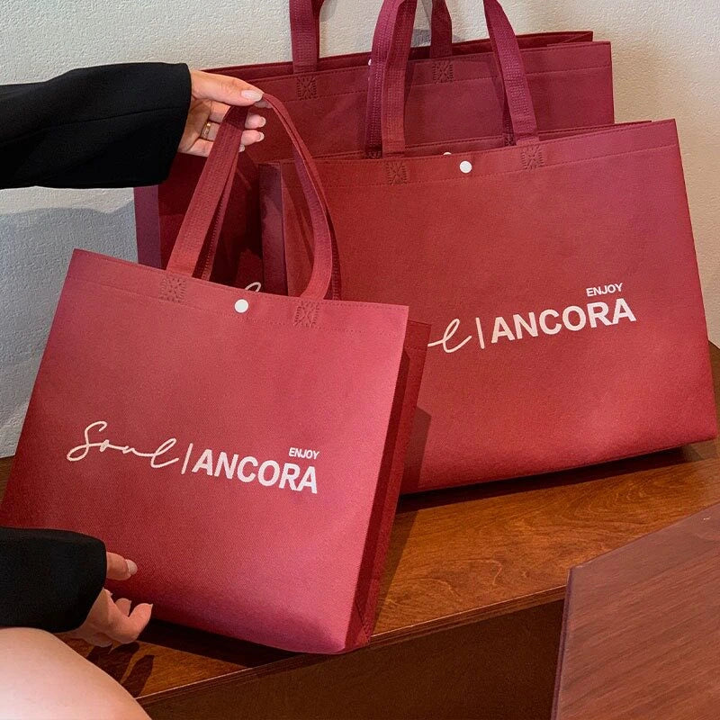 Ancora Red Print webbing-handle non-woven tote bags — 7 styles