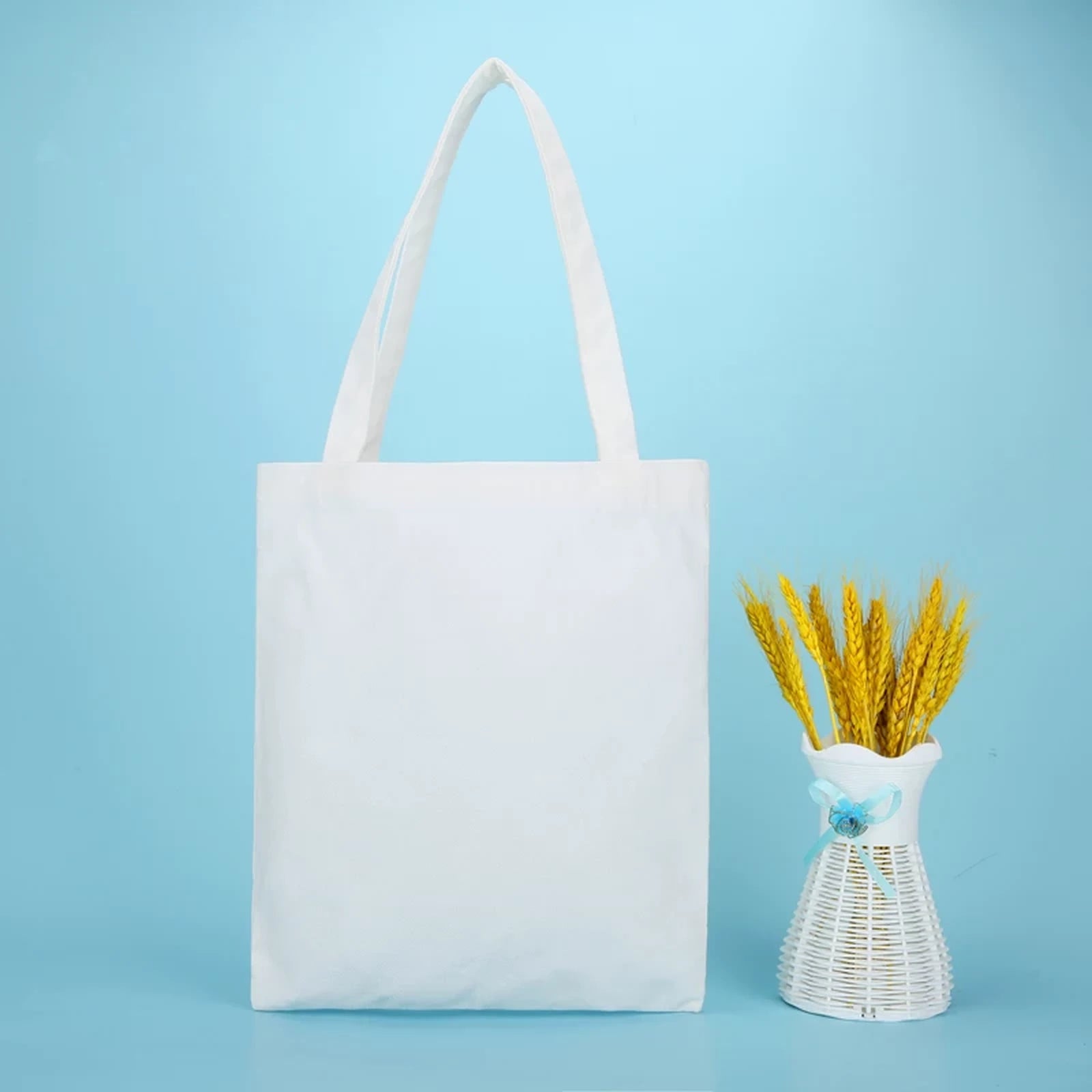 White open-top canvas tote bag 28 by 33 cm