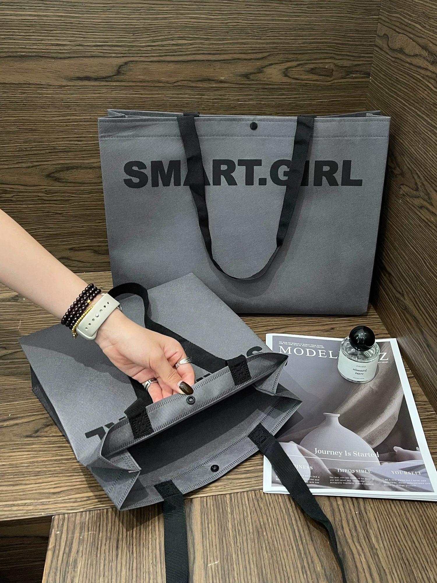 Woven-handle non-woven tote bags for retail packaging